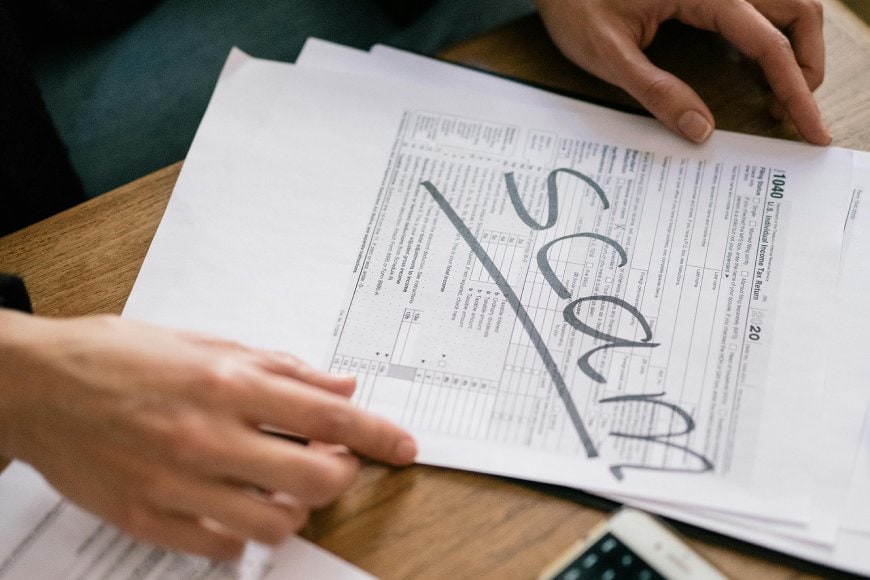 Page with SCAM written diagonally across it